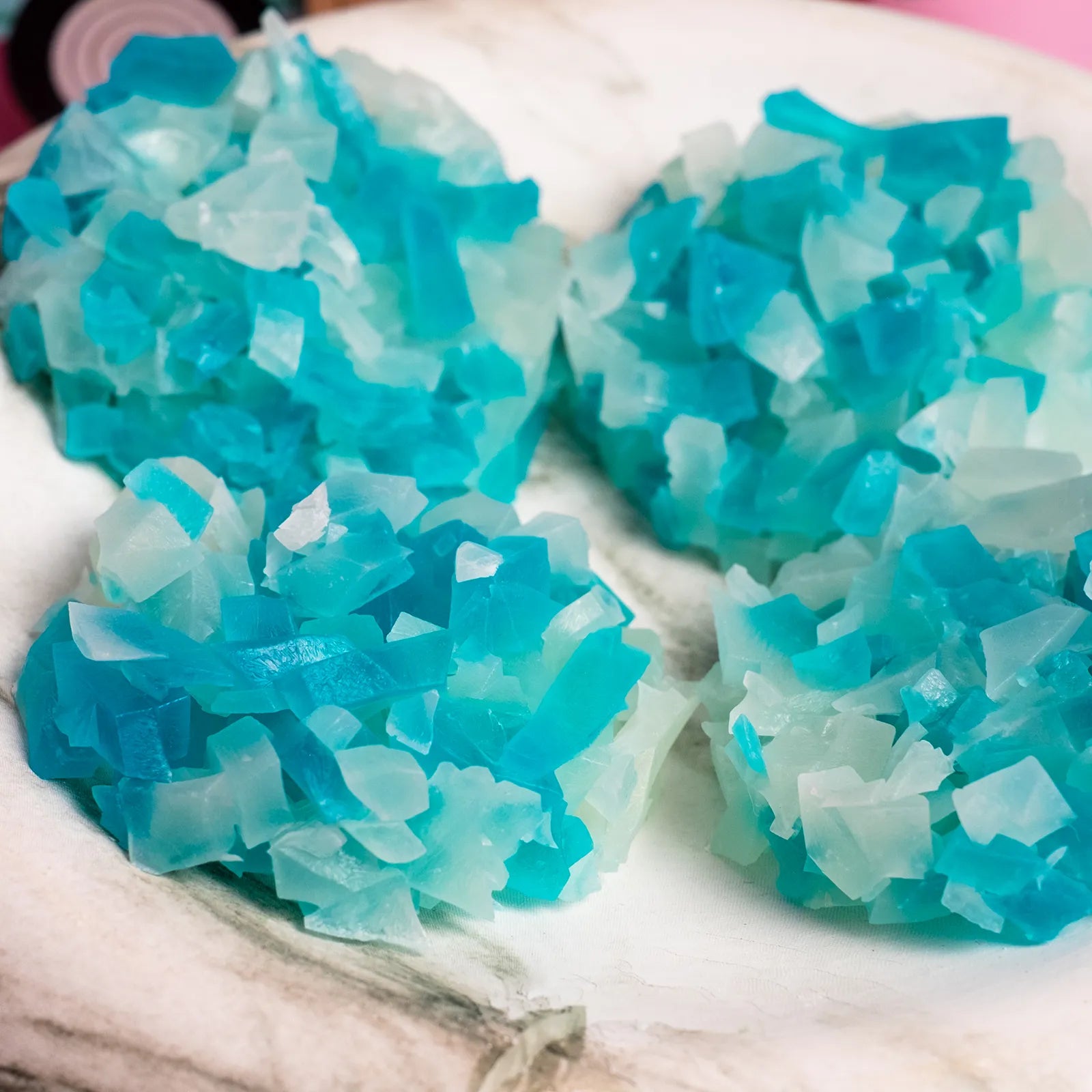 Blue and white Christmas crystal candy on a white plate.