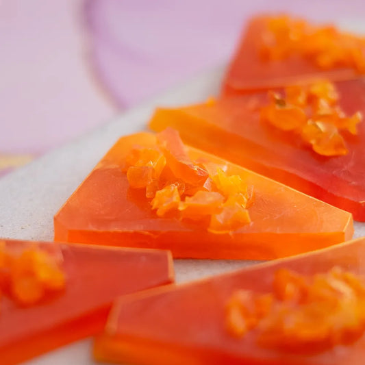 Close-up Orange Mango kohakutou, crunchy shell and bouncy jelly centre.